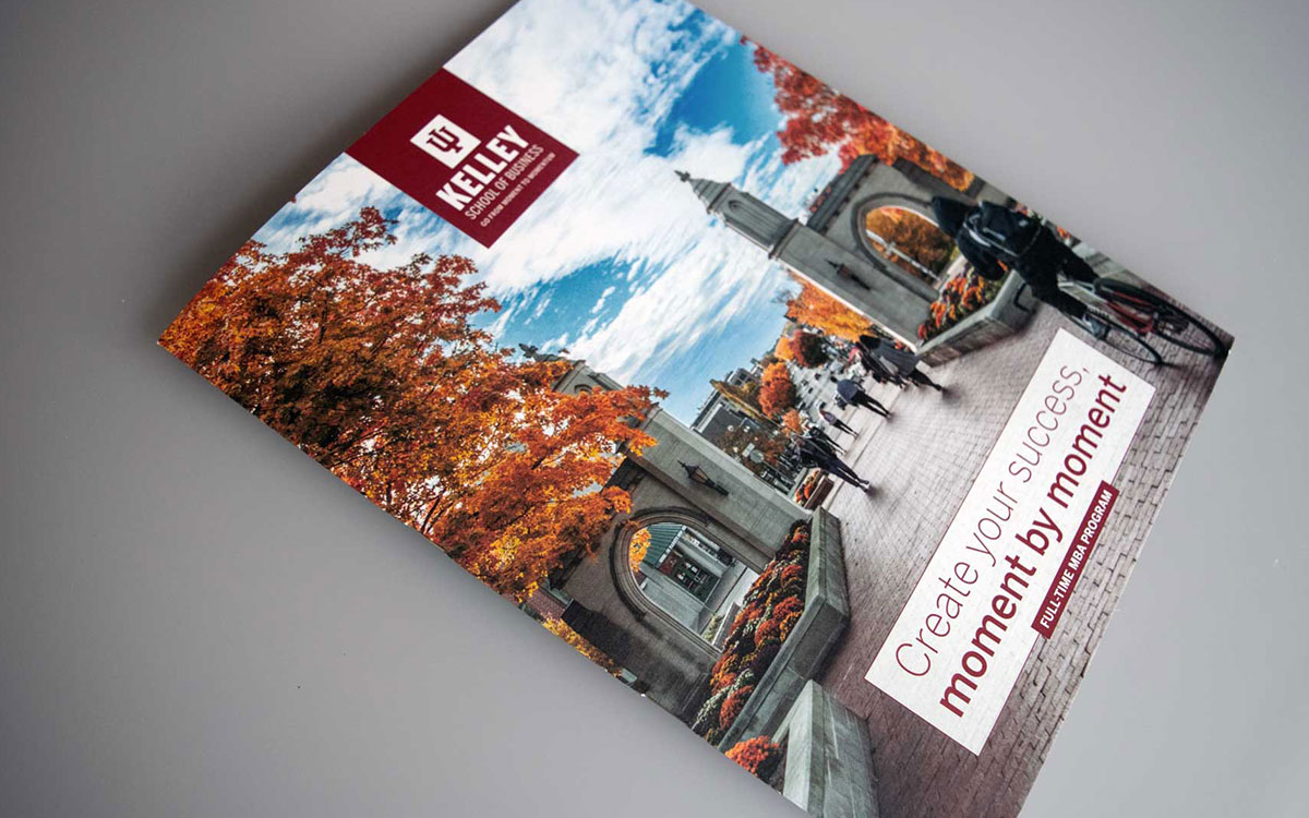 MBA Viewbook cover showing people walking toward downtown Bloomington from campus, in the fall.