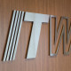 ITW metal logo on wood paneling