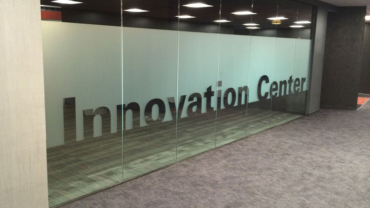 ITW Innovation Center conference room with frosted glass title graphic