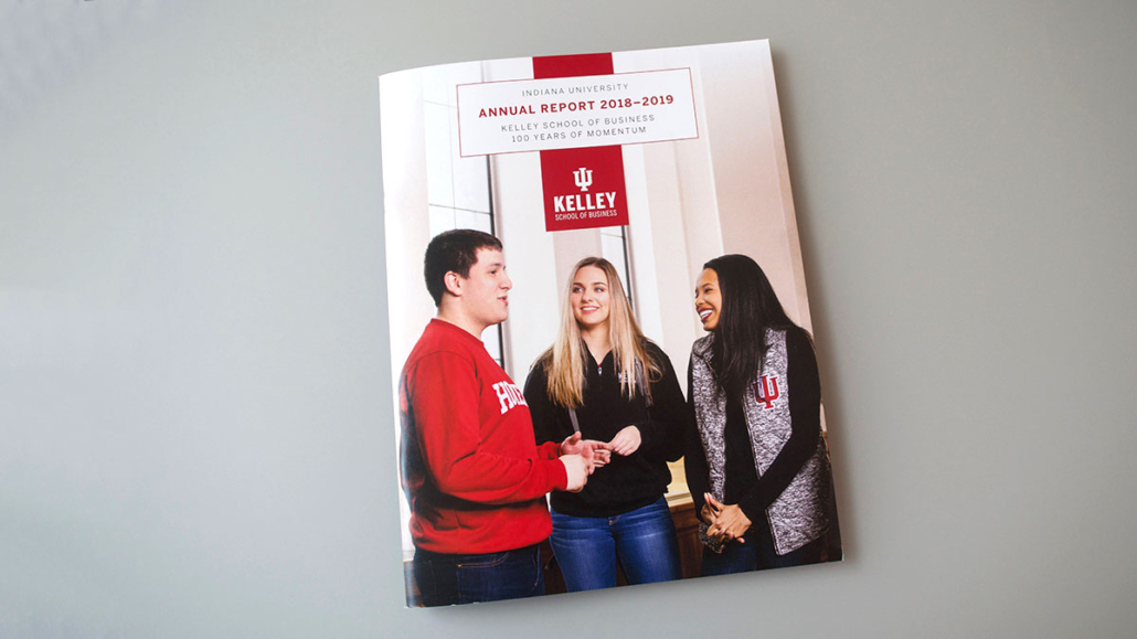 Kelley School of Business Annual Report Cover showing three students laughing and talking inside of the building