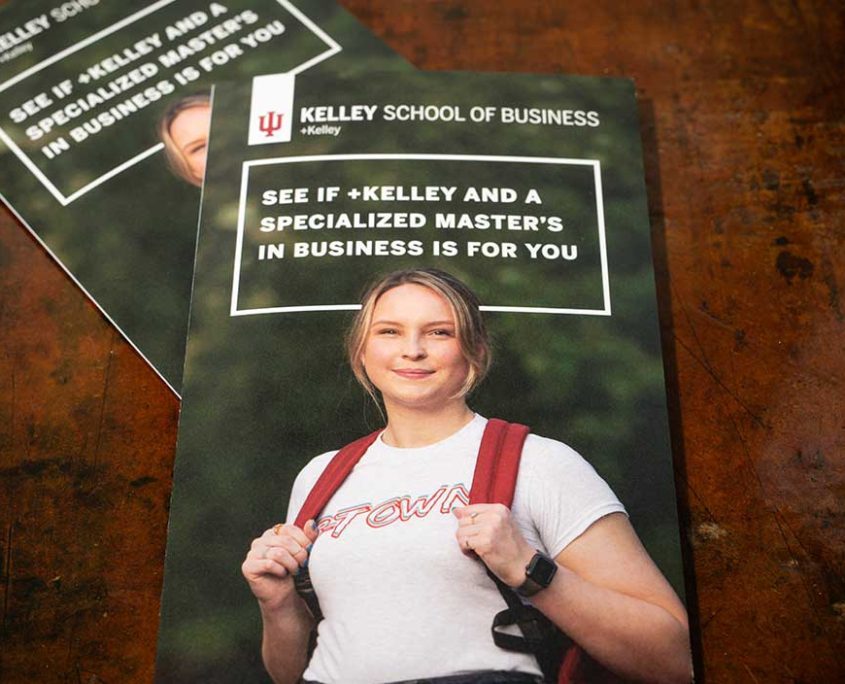 Two brochures for Plus Kelley program, one on top of the other. There's a girl on the front cover dressed in a Bloomington tshirt, smiling. The header says "See if Plus Kelley and a Specialized Master's in Business is for you"